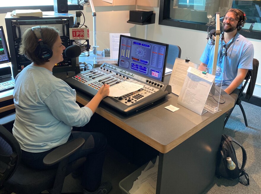 IPR's music director Amanda Sewell talks with conductor Christian Reif in IPR's Studio B