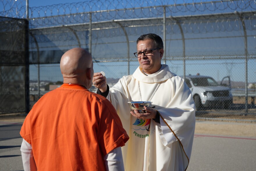 San Bernardino Diocese Bishop Alberto Rojas providing