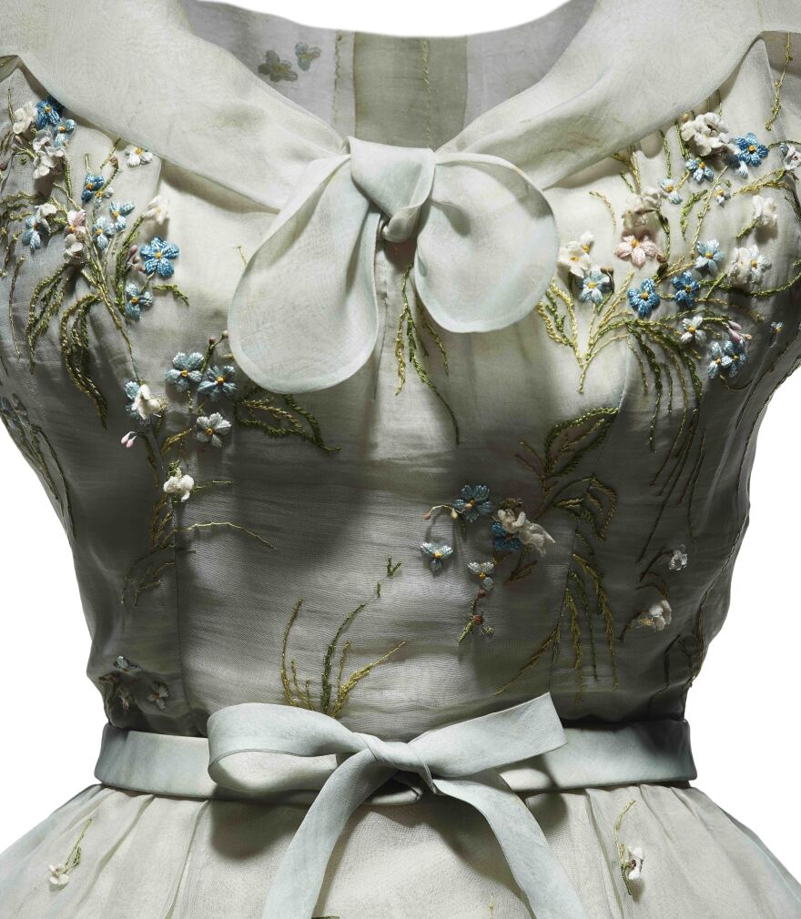 An afternoon dress in pale blue organdie, embroidered with pink and blue forget-me-nots, was part of Dior's spring-summer 1953 haute couture collection, Tulipe line.