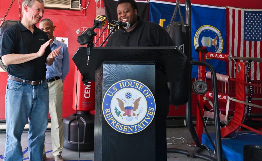 Angel Johnson jokes with U.S. Rep. Matt Cartwright while talking about how Pulpit Boxing improved his life.