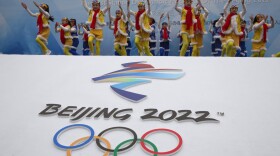 Chinese performers dance during a ceremony to mark the arrival of the Olympic flag and start of the flag tour for the Winter Olympic Games Beijing 2022 at a section of the Great Wall of China on the outskirts of Beijing on Feb. 27, 2018. (Ng Han Guan/AP)