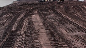 Stamp sand removal from the beach along Lake Superior is shown from 2019.