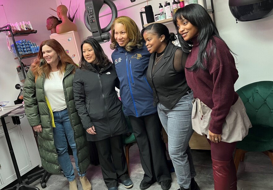 Georgette Steffens, Executive Director of the Downtown Albany Business Improvement District; NYS Office of General Services Commissioner Jeanette Moy; Christina and Crystal Mallett, co-owners of Studio 23.