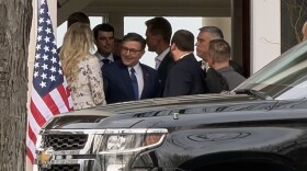 House Speaker Mike Johnson, center, leaves the Moosic home of businessman William Rosado following a visit to raise funds for the reelection of U.S. Rep. Rob Bresnahan, seen behind Johnson to the left.