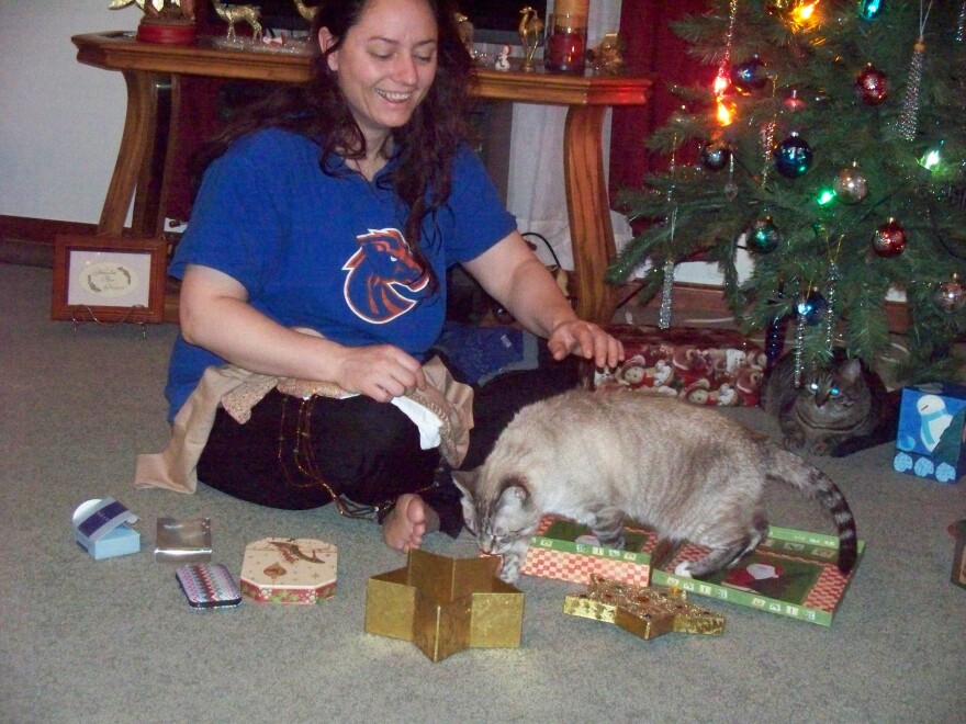 Charee Nelson at Christmas with her family’s cat in 2016. Nelson is one of seven women who filed complaints of sexual abuse against Idaho prison workers in the summer of 2024. InvestigateWest found that none of their complaints were properly investigated.