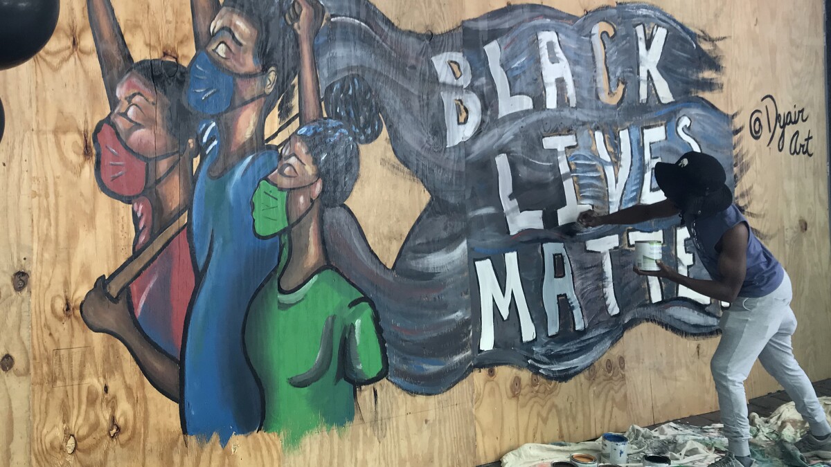 'This Is History': Protest Precautions Give Charlotte Artists New Canvas |  WFAE 90.7 - Charlotte's NPR News Source