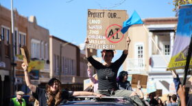 Students from the New Mexico School for the Arts in Santa Fe marched to the Capitol for the “Pull Out the Plug” protest on Oct. 27, 2026.