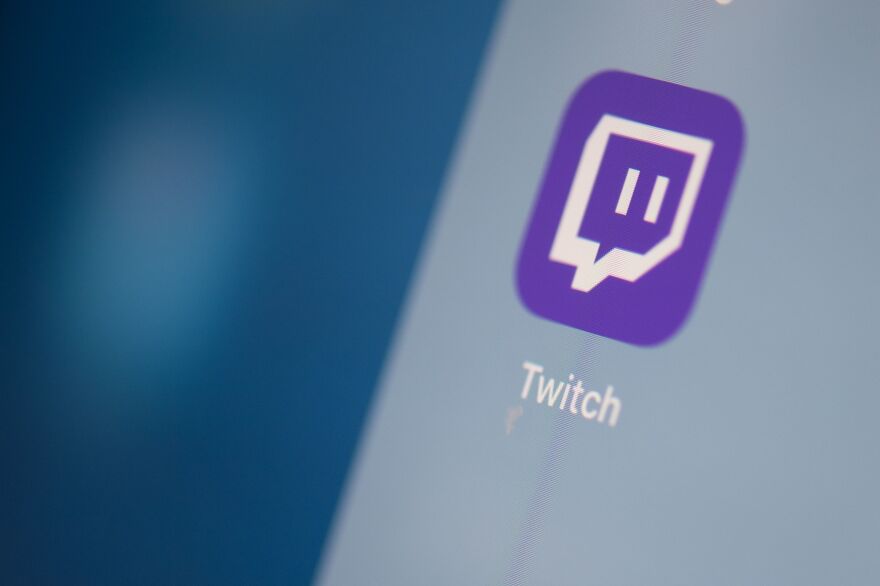 A Twitch logo is seen on the screen of a tablet in this 2019 photo.