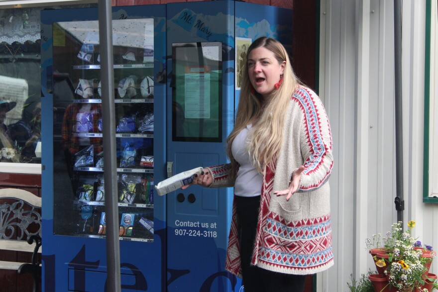 Kristin Wise explains how to use a new community health vending machine during an unveiling ceremony on Wednesday, July 22, 2026 in Seward, Alaska.