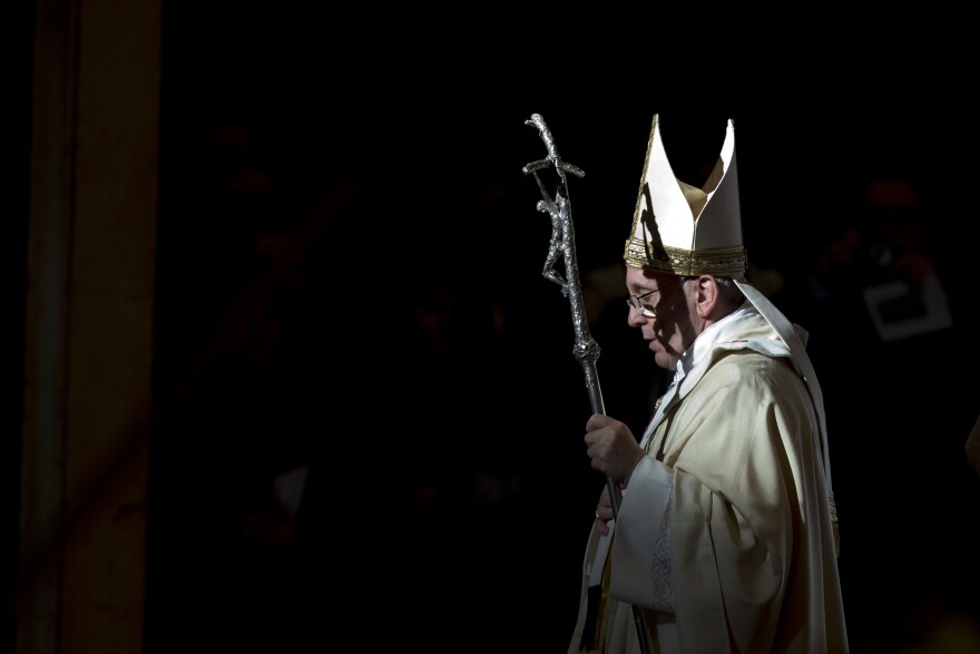 FILE - Pope Francis holds the pastoral staff as he leaves after celebrating a Mass in St. Peter's Basilica, at the Vatican, to mark Epiphany, Monday, Jan. 6, 2014.
