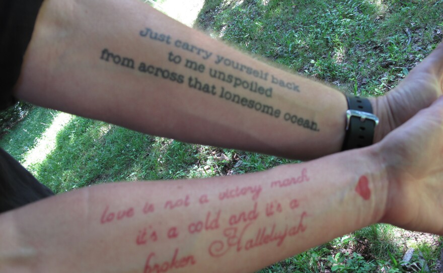 A match made in ink heaven: Jason Isbell has the lines from Bob Dylan's "Boots of Spanish Leather" on his arm, while his wife, singer-songwriter Amanda Shires, has lines from Leonard Cohen's "Hallelujah" on hers.