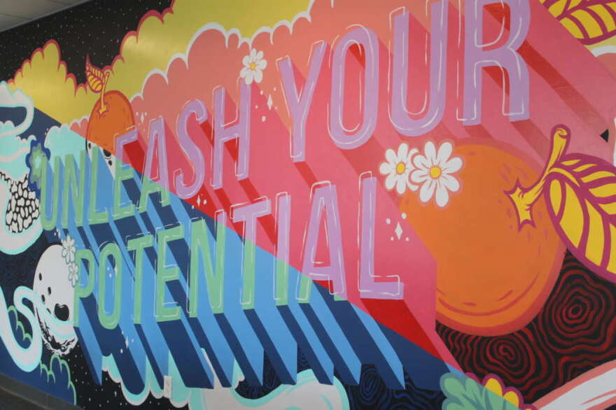 UCF grad Harry Foreman created the 'Unleash Your Potential' mural. More than 7,000 students will start at the downtown UCF campus next Monday. Photo: Danielle Prieur