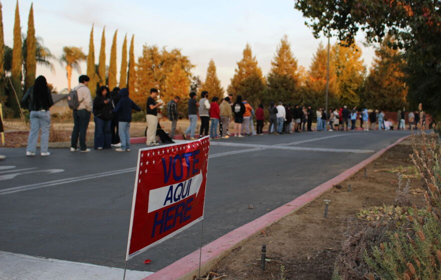 Voters line up outside St. Patrick's Catholic Church in Merced, Calif.