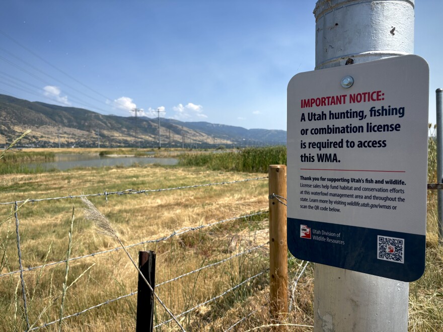 The Utah Department of Natural Resources has posted signs at Wildlife Management Areas like this one at Farmington Bay to let people know they need a license to recreate. July 24, 2025.