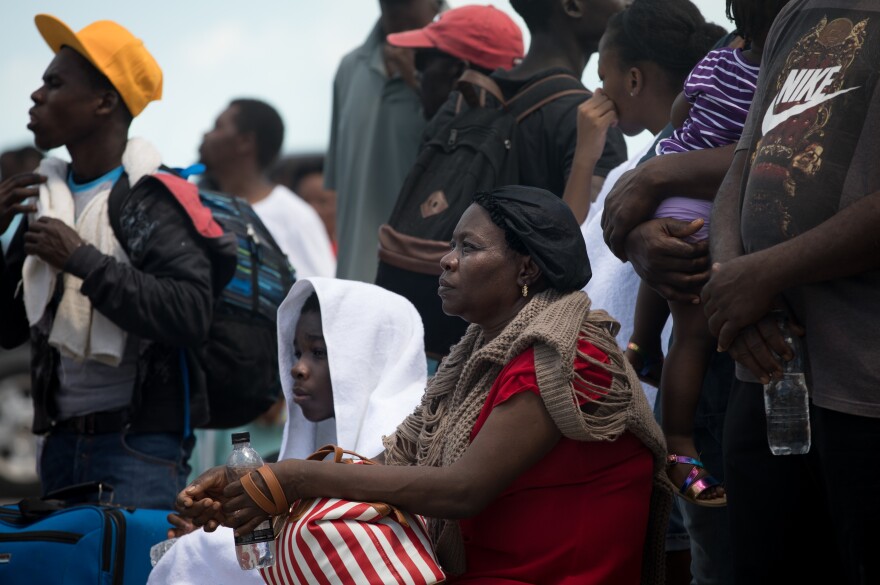 Geno and Medilia Raymonville wait to leave in Marsh Harbour. Food, water and other supplies are rapidly running out.