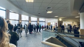 A line winds around the second floor of the downtwn branch of the public library on the second day of early voting in Lexington.