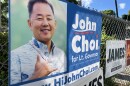 A sign for John Choiʻs lieutenant governor campaign hangs on a fence on Pali Highway in Honolulu on Thursday, June 23, 2026.