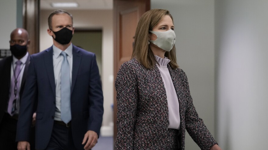 Supreme Court nominee Amy Coney Barrett arrives for the third day of her confirmation hearing with the Senate Judiciary Committee, on Capitol Hill in Washington, Wednesday, Oct. 14, 2020. (AP Photo/J. Scott Applewhite)