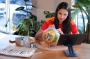 Artist Lili Cantero paints a soccer ball with images commemorating Spain's 2010 World Cup victory as part of the launch of the Wynwood United Soccer Ball Art Trail, which will showcase hand-painted soccer balls honoring historic World Cup championships inside local businesses, April 8, 2026, at Rodilla cafe in the Wynwood district of Miami.
