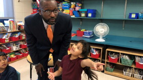 Kansas City Public Schools Superintendent Mark Bedell visits students at J.A. Rogers Elementary. Students at the school who have perfect attendance at the school are entered into a drawing for a bike each month.