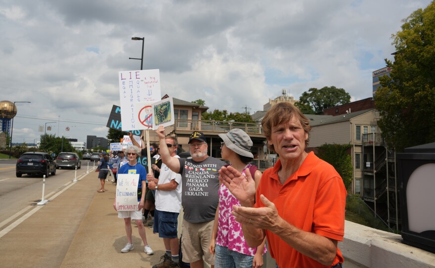 Demonstrators participate in Indivisible Knoxville’s Labor of Love protest on Henley Street Bridge in Knoxville on September 1, 2025.