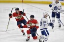 Florida Panthers center Sam Reinhart, center, celebrates scoring the game-winning goal against the Toronto Maple Leafs during overtime of Game 3 of an NHL hockey Stanley Cup second-round playoff series, Sunday, May 7, 2023, in Sunrise, Fla. 