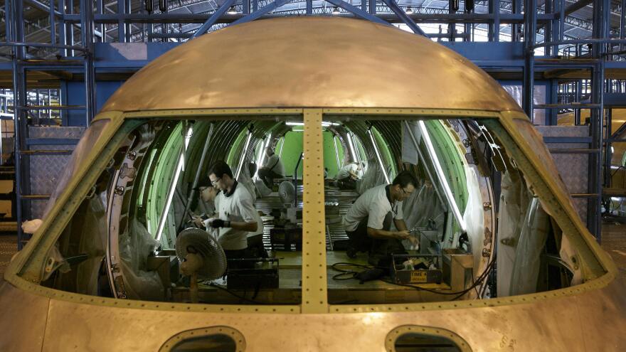 Brazilian technicians assemble an aircraft at an Embraer plant, in Sao Jose dos Campos, north of Sao Paulo, in 2007. Embraer is a relatively rare example of a high-tech industry in Latin America that has built an international reputation.