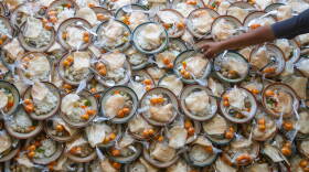 A Muslim person prepares meals for breaking fast during the Islamic holy month of Ramadan. (Devi Rahman/AFP via Getty Images)