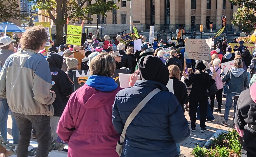 People listen to speakers during the No Kings protest rally in downtown Buffalo, Saturday, Oct. 18, 2026.