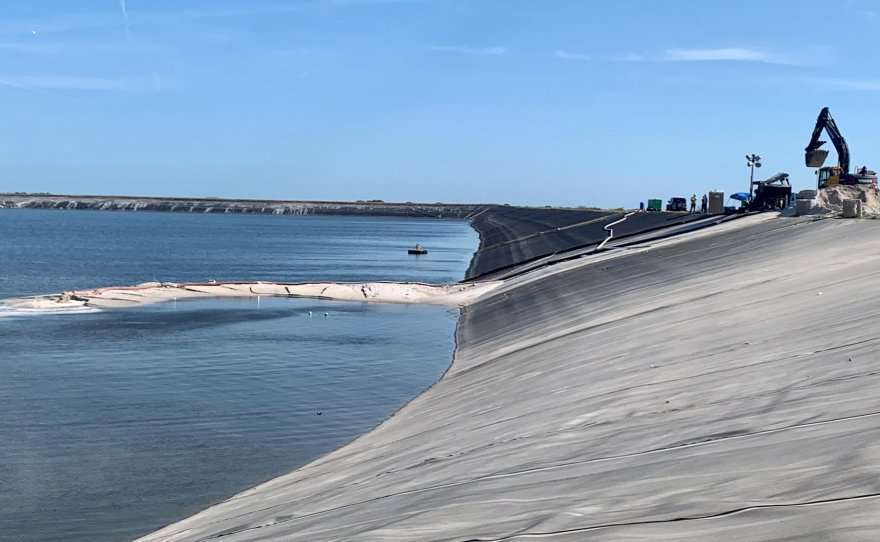 Construction crews atop the Piney Point gypstack labor to seal the breach on May 16. Photo courtesy WUSF