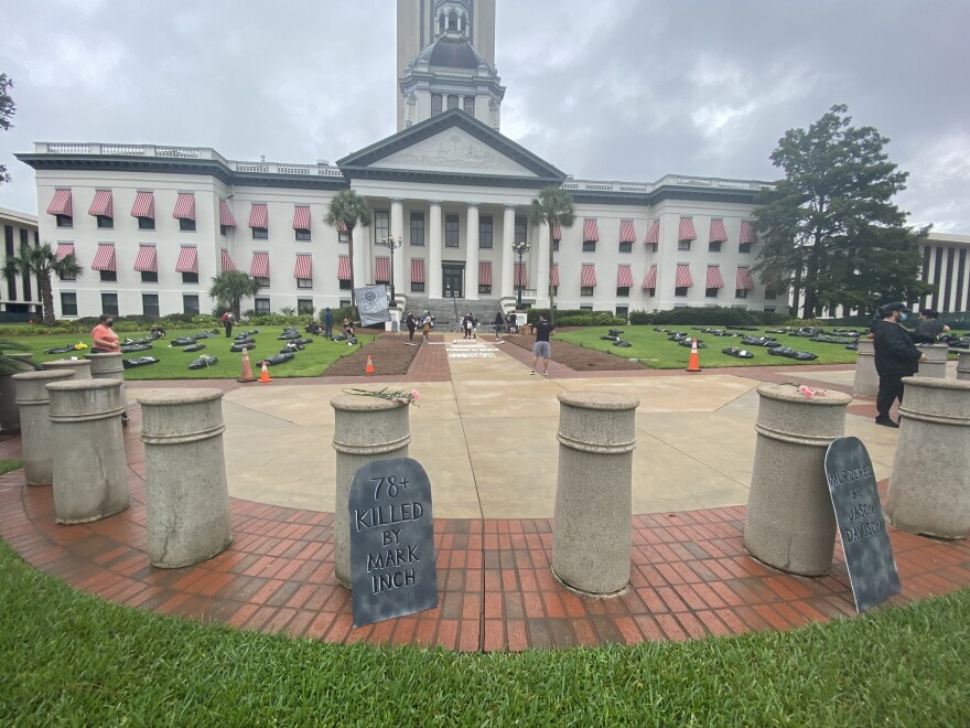 A mock-graveyard on the Historic Capitol grounds created by the Florida Prisoner Solidarity.