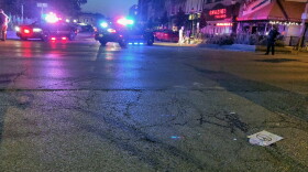 Sheriff's deputies survey the aftermath of a hit-and-run that injured at least one person at a rally against racism in downtown Bloomington.