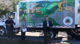 Jesse Severson with Hungry Hearts, Gay Anderson and James Nold with the Sioux Falls School District speak at a press conference on Oct. 06, 2026.