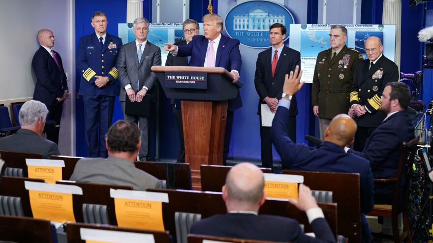 President Trump takes questions from the press during a briefing on April 1, after announcing enhanced drug operations.