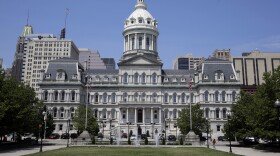 Baltimore's City Hall building faces a public square, Tuesday, July 8, 2014, in Baltimore. (AP Photo/Patrick Semansky)