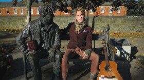 David Keenan sits with a statue of the beloved Irish writer and poet Brendan Behan along the Royal Canal in Dublin.