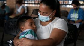 Venezuelan asylum seeker Jhinezka de Arias holds her son Cristhofer at the bus station in Brownsville, Texas, on Feb. 25.