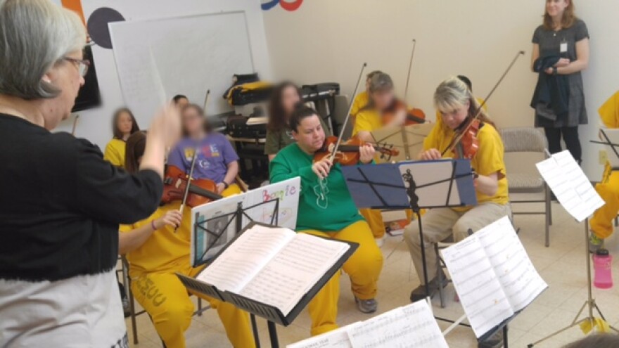 Winona Fletcher and Cassandra Hunicke play with the Hiland Orchestra on March 7, 2017. (Photo by Corey Allen-Young, courtesy of Dept. of Corrections.)