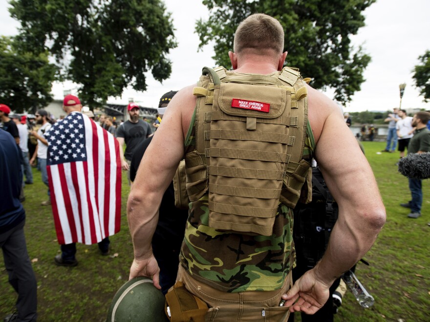 A member of the Proud Boys wears body armor during a rally in Portland, Ore., in August 2019.