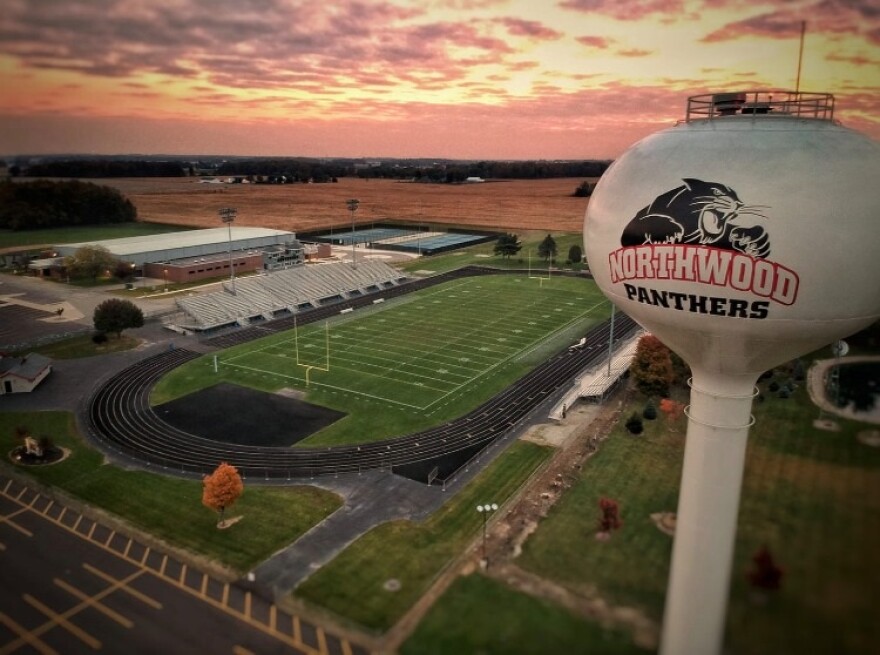 An aerial view of the football stadium at NorthWood High School, where a former student has filed a lawsuit alleging an intoxicated bus driver endangered choir students during a 2024 field trip to Michigan.