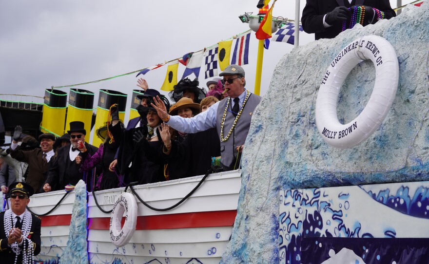 People gather on a float dressed up 