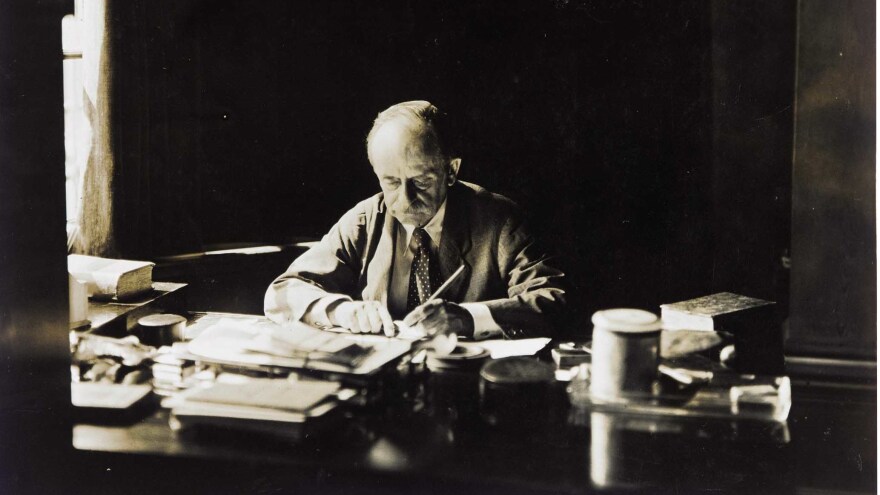 J.M. Barrie, at work at his desk in an undated photograph.