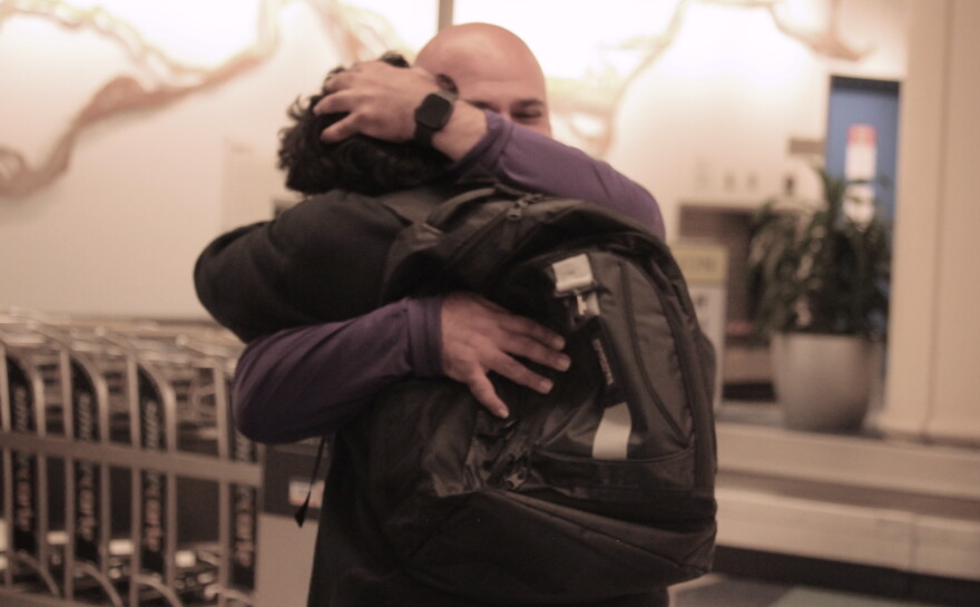 Sebastian Jimenez Peroza hugs his football coach, Ashour Peera, who advocated for his release from immigration detention facilities. (María Sofía Rodríguez/WUFT News)