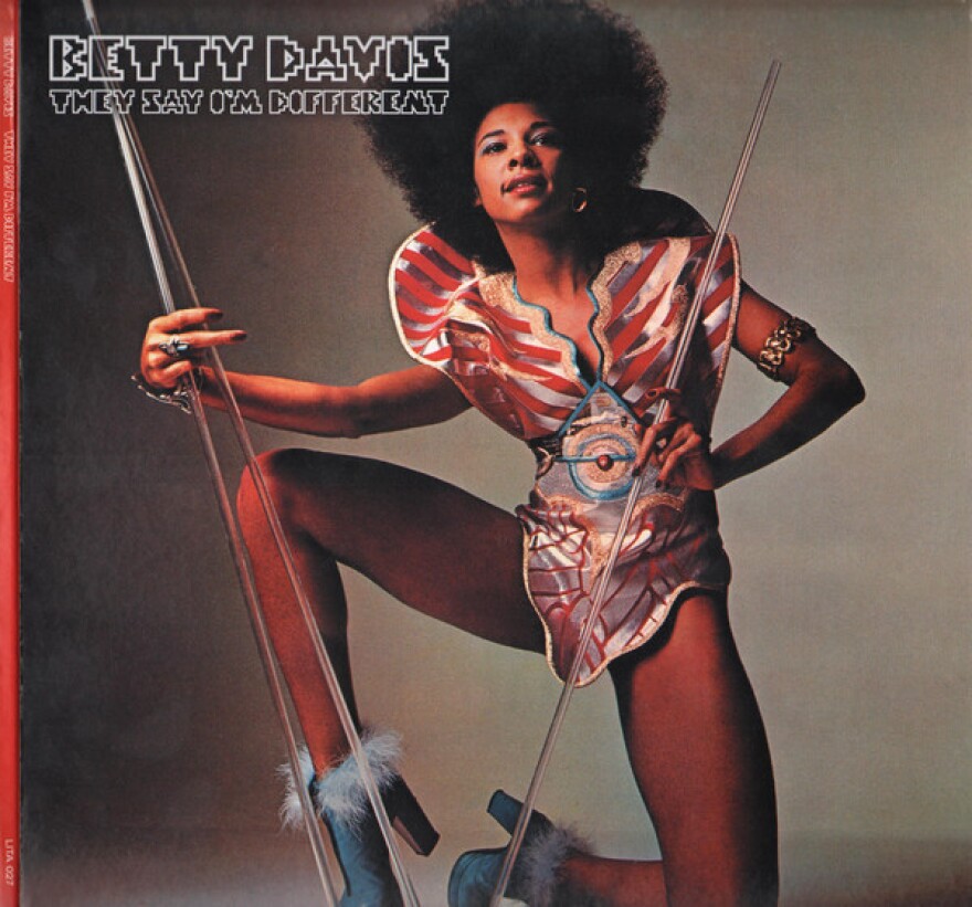 album cover featuring a black woman with an afro in an amazing costume