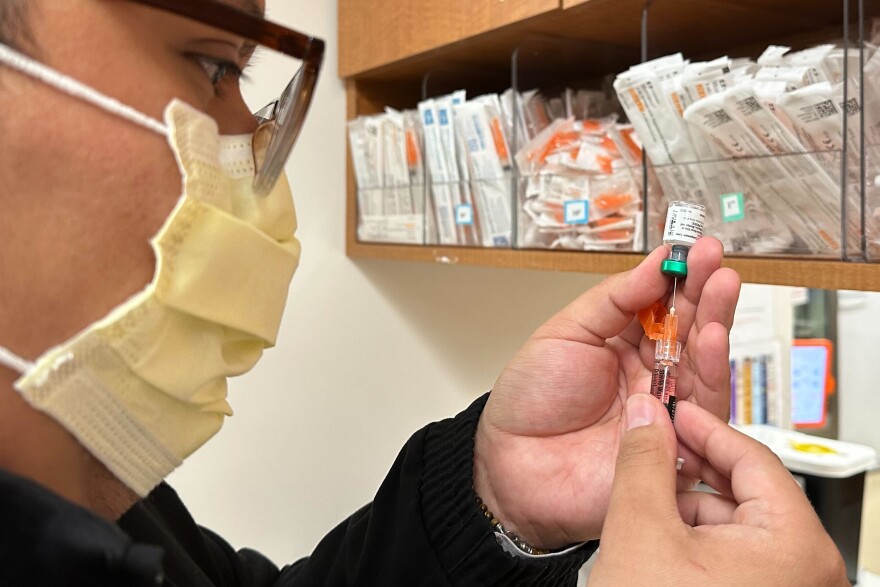 AP file image of licensed practical nurse Marco Flores prepares a patient's measles, mumps and rubella vaccine at Children's Minnesota on Nov. 20, 2025, in Minneapolis.