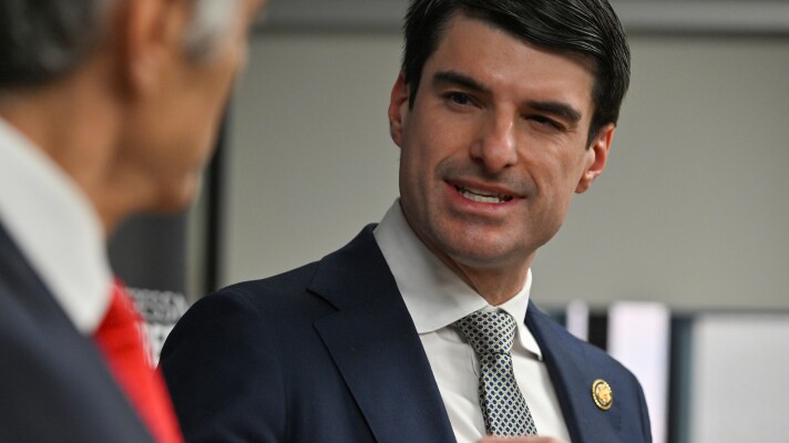 Representative Rob Bresnahan listens to Mehmet Oz at a press conference at the Commonwealth Medical Center in Scranton.