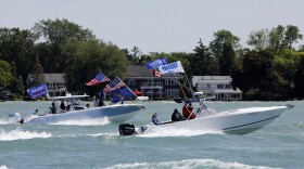 Boaters participate in the "Make america Great Again" parade as they celebrate US President Donald Trump's 74th birthday on the Detroit River in Detroit, Michigan on June 13, 2020. - The parade is hosted by the Michigan Conservative Coalition and Michigan Trump Republicans 2020. (Jeff Kowalsky/AFP)