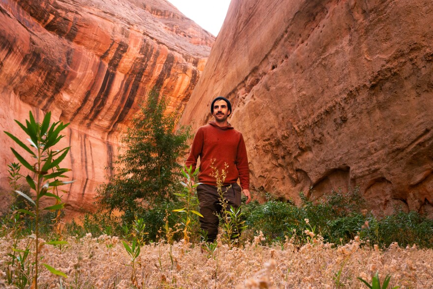 Eric Balken, executive director of the Glen Canyon Institute, walks through a canyon that was filled by Lake Powell until recent years.