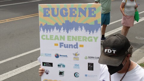 Eugene Clean Energy Fund supporters march through downtown Eugene, July 21, 2026.