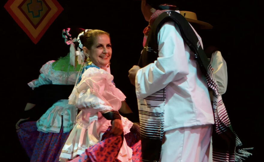 Belinda Menchaca and unnamed partner dance.
